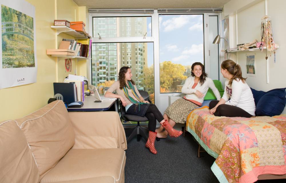 Students sit in a room inside Rodin College House