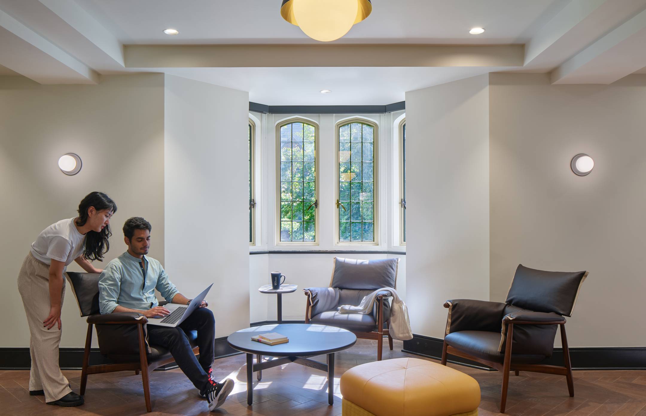 Quad window seating area with two students